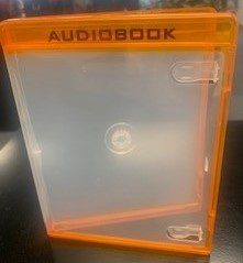 Orange audiobook case on a dark surface.