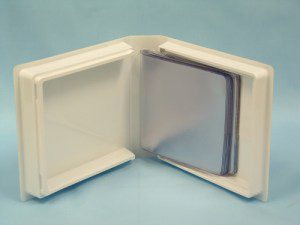 Open CD case with empty plastic sleeves.