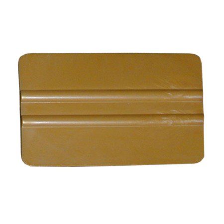 Brown plastic squeegee with grooved surface.
